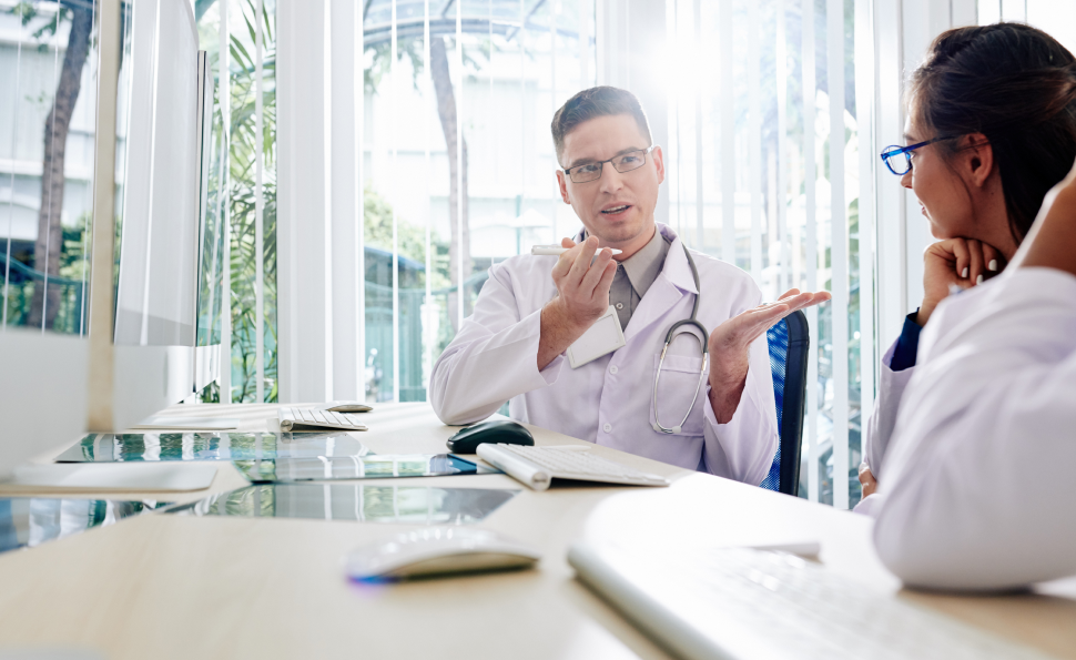 Doctor discussing life-saving treatment options, representing giving the gift of life