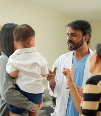 Doctor guiding a family about saving a child’s life, inspiring hope through medical care