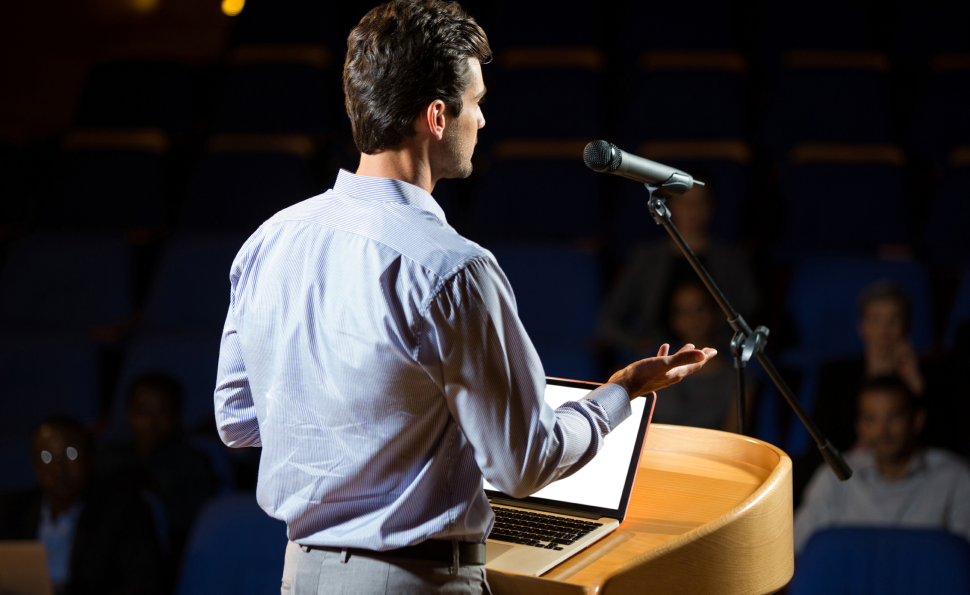 Speaker inspiring an audience to pledge organs and save lives