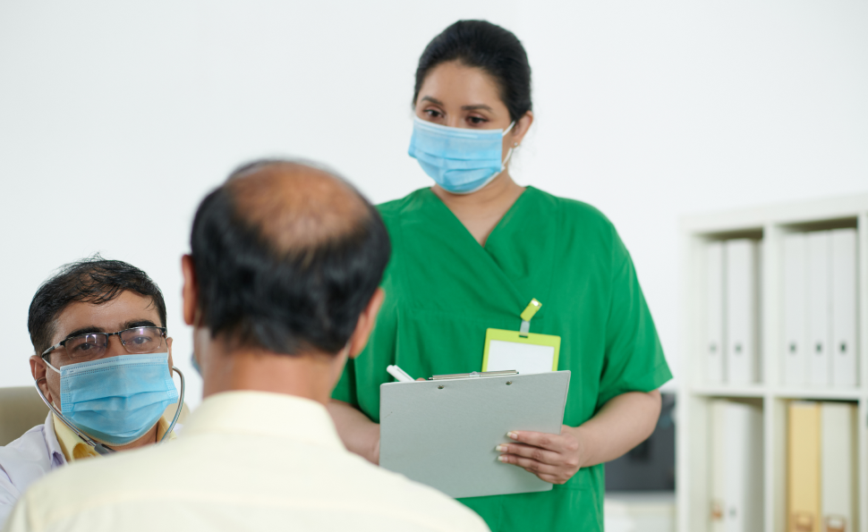 Healthcare team guiding a person about organ donation and pledging organs